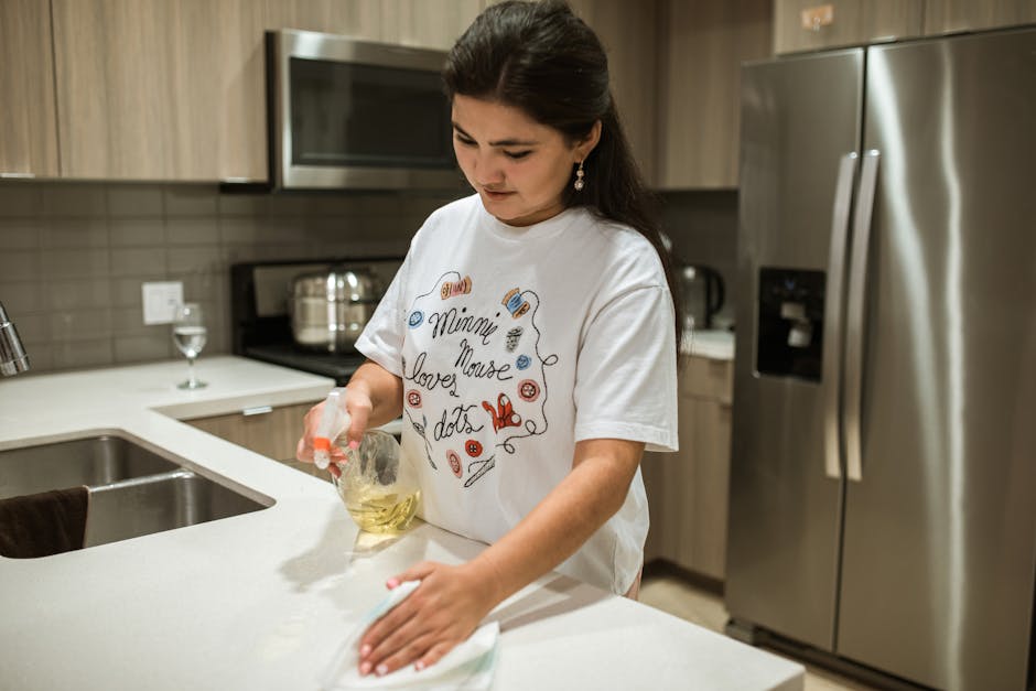 Wiping clean kitchen counter